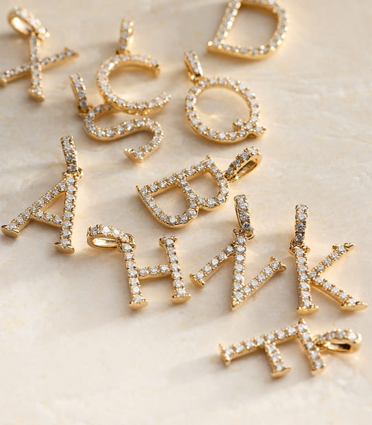 Alphabet jewelry with yellow gold and diamonds
